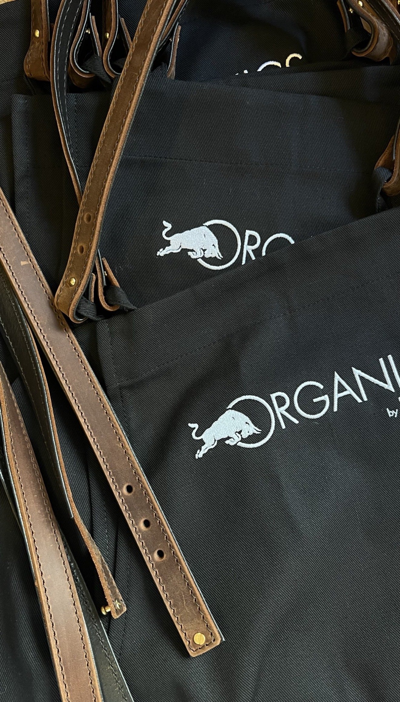 Custom aprons for Red Bull with leather neck straps