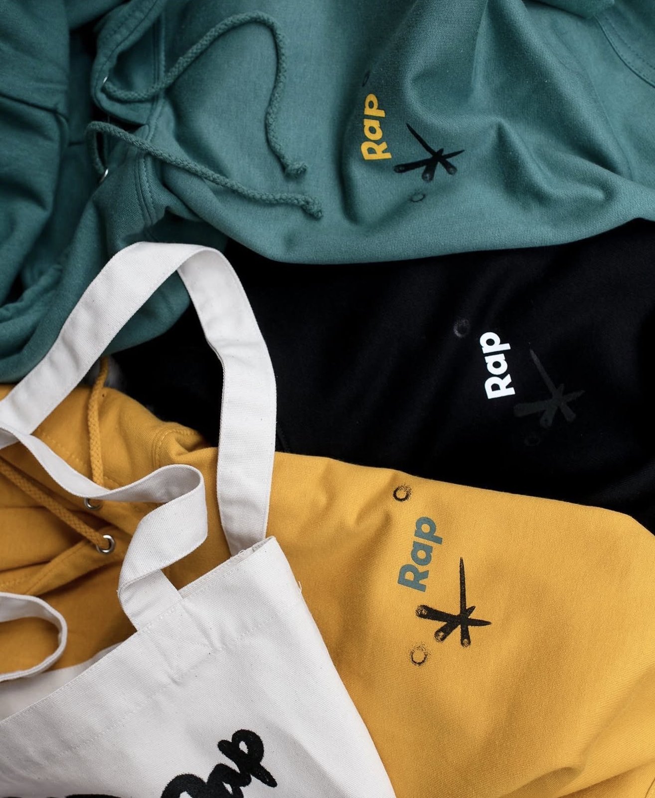 Hoodies with a small logo and a tote bag